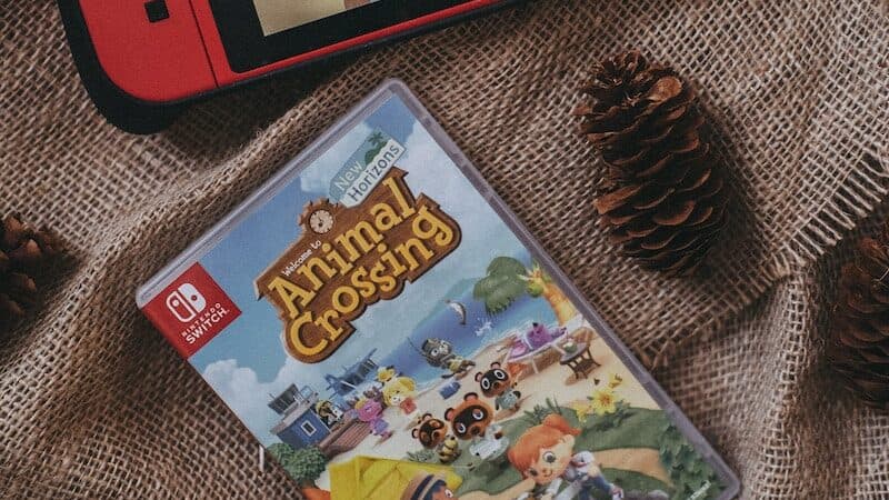 a nintendo wii game sitting on top of a blanket