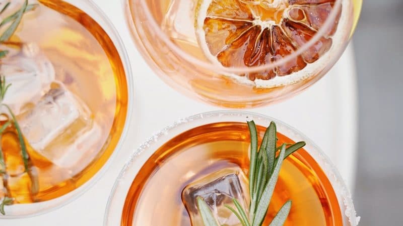 four glass cups on white surface